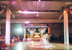 Indian bride and groom performing a choreography during the reception. Indian bride and groom performing a choreography during the reception.