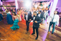 Guests performing a choreography during the Indian wedding reception. Guests performing a choreography during the Indian wedding reception.