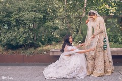 Indian bride being assisted by special guest prior to the ceremony. Indian bride being assisted by special guest prior to the ceremony.