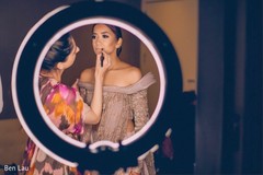 Indian bride being assisted by makeup artist prior to the ceremony. Indian bride being assisted by makeup artist prior to the ceremony.