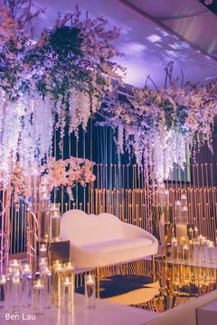 Lighting and floral decor of the Indian wedding reception venue. Lighting and floral decor of the Indian wedding reception venue.