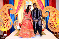 Maharani wearing a red anarkali and her Raja. Maharani wearing a red anarkali and her Raja.