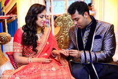 Indian groom putting ring on his Maharani. Indian groom putting ring on his Maharani.