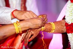 Indian groom tying thread on his Maharani's wrist. Indian groom tying thread on his Maharani's wrist.