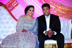 Indian bride in sky blue gown with her Indian groom in suit. Indian bride in sky blue gown with her Indian groom in suit.