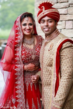 Indian couple wearing their Indian wedding clothes. Indian couple wearing their Indian wedding clothes.
