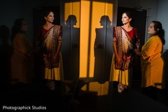 Indian bride getting her ceremony outfit on computer. Indian bride getting her ceremony outfit on computer.