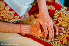 Wonderful Indian bridal mehndi art on her hands. Wonderful Indian bridal mehndi art on her hands.
