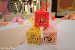 Laser cut Indian engagement red pink and yellow favor boxes. Laser cut Indian engagement red pink and yellow favor boxes.