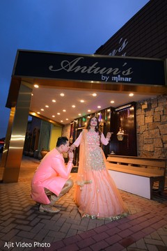 Indian groom kissing bride's hand. Indian groom kissing bride's hand.