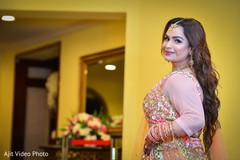 Maharani posing on her engagement pink lehenga. Maharani posing on her engagement pink lehenga.