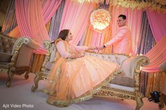 Indian couple at their engagement pink, peach and golden stage. Indian couple at their engagement pink, peach and golden stage.