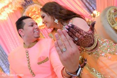 Indian lovebirds with gold engagement rings. Indian lovebirds with gold engagement rings.