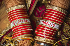 Golden Indian bride bracelets with details. Golden Indian bride bracelets with details.