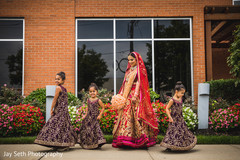 Maharani in red lengha with Indian children. Maharani in red lengha with Indian children.
