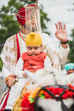 Raja riding his horse with an Indian child in Baraat. Raja riding his horse with an Indian child in Baraat.