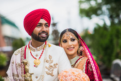 Maharani wearing a red Lengha and Indian groom with red turban. Maharani wearing a red Lengha and Indian groom with red turban.