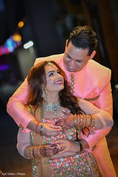 Indian couple posing with their engagement celebration outfits. Indian couple posing with their engagement celebration outfits.
