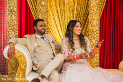 Indian couple looking amused during the reception. Indian couple looking amused during the reception.
