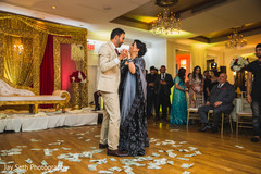 Indian groom dancing with an Indian relative. Indian groom dancing with an Indian relative.