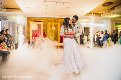 Indian couple performing in their reception party. Indian couple performing in their reception party.