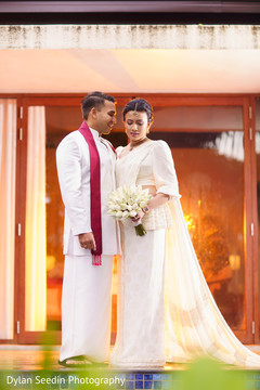 Indian bride and groom wearing the wedding attires for pictures. Indian bride and groom wearing the wedding attires for pictures.
