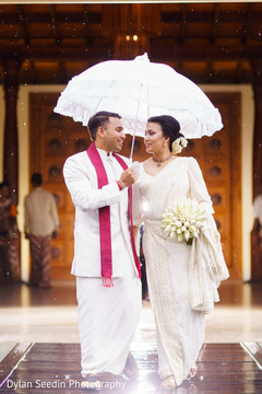 Indian groom holding the umbrella for the Maharani. Indian groom holding the umbrella for the Maharani.