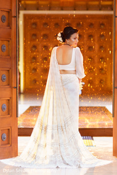 Indian bride posing for the photoshoot prior to the ceremony. Indian bride posing for the photoshoot prior to the ceremony.