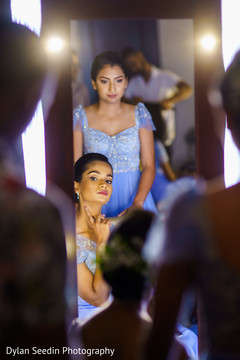 Bridesmaids posing for pictures as they get ready. Bridesmaids posing for pictures as they get ready.