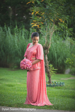 Indian bride holding the bouquet and posing for pictures. Indian bride holding the bouquet and posing for pictures.