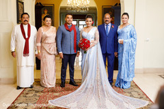 Indian newlyweds posing with both families. Indian newlyweds posing with both families.