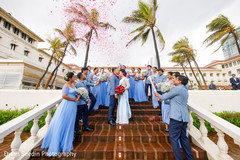 Indian newlyweds posing with bridesmaids and groomsmen. Indian newlyweds posing with bridesmaids and groomsmen.