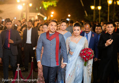 Indian groom wearing a grey sherwani and Indian bride in anarkali. Indian groom wearing a grey sherwani and Indian bride in anarkali.