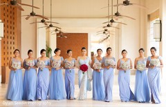 Maharani and her Indian bridesmaids holding rose bouquets. Maharani and her Indian bridesmaids holding rose bouquets.