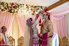 Maharani placing a necklace on the groom Maharani placing a necklace on the groom