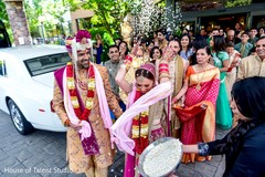 Maharani tossing rise to the guests. Maharani tossing rise to the guests.