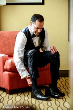 Indian groom putting shoes on. Indian groom putting shoes on.