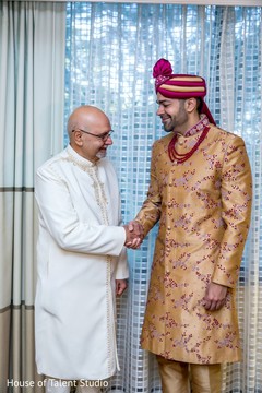 Indian groom stretching an Indian relative's hand. Indian groom stretching an Indian relative's hand.
