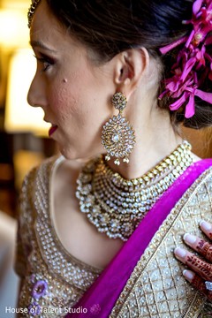 Maharani showing diamond decorated earring. Maharani showing diamond decorated earring.