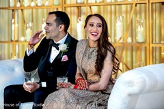Indian couple with reception clothes having a drink. Indian couple with reception clothes having a drink.