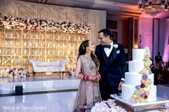 Maharani and her Indian groom in front of the wedding cake. Maharani and her Indian groom in front of the wedding cake.