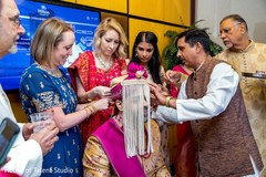 Indian groom being assisted with the turban and sehra. Indian groom being assisted with the turban and sehra.
