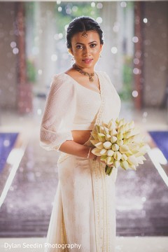 Portrait of the Maharani wearing the white bridal saree and bouquet. Portrait of the Maharani wearing the white bridal saree and bouquet.