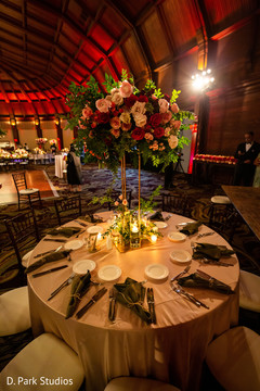 Indian wedding table setup and tall roses centerpiece decoration. Indian wedding table setup and tall roses centerpiece decoration.