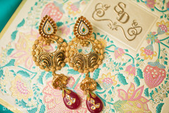 Indian bridal ceremony gold earrings with stones. Indian bridal ceremony gold earrings with stones.
