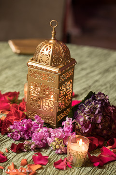 Golden Indian wedding table lantern decorations. Golden Indian wedding table lantern decorations.