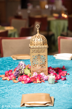 Golden with light coral blue table decorations. Golden with light coral blue table decorations.