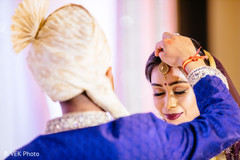 Maharani receiving the bindi under the tikka by the Raja. Maharani receiving the bindi under the tikka by the Raja.