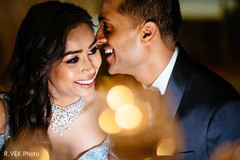 Indian bride and groom smiling during the reception photoshoot. Indian bride and groom smiling during the reception photoshoot.