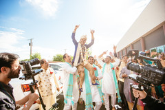 Indian groom being lifted by groosmen during baraat. Indian groom being lifted by groosmen during baraat.